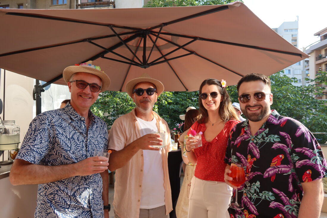Team members enjoying the summer terrace party under the sun