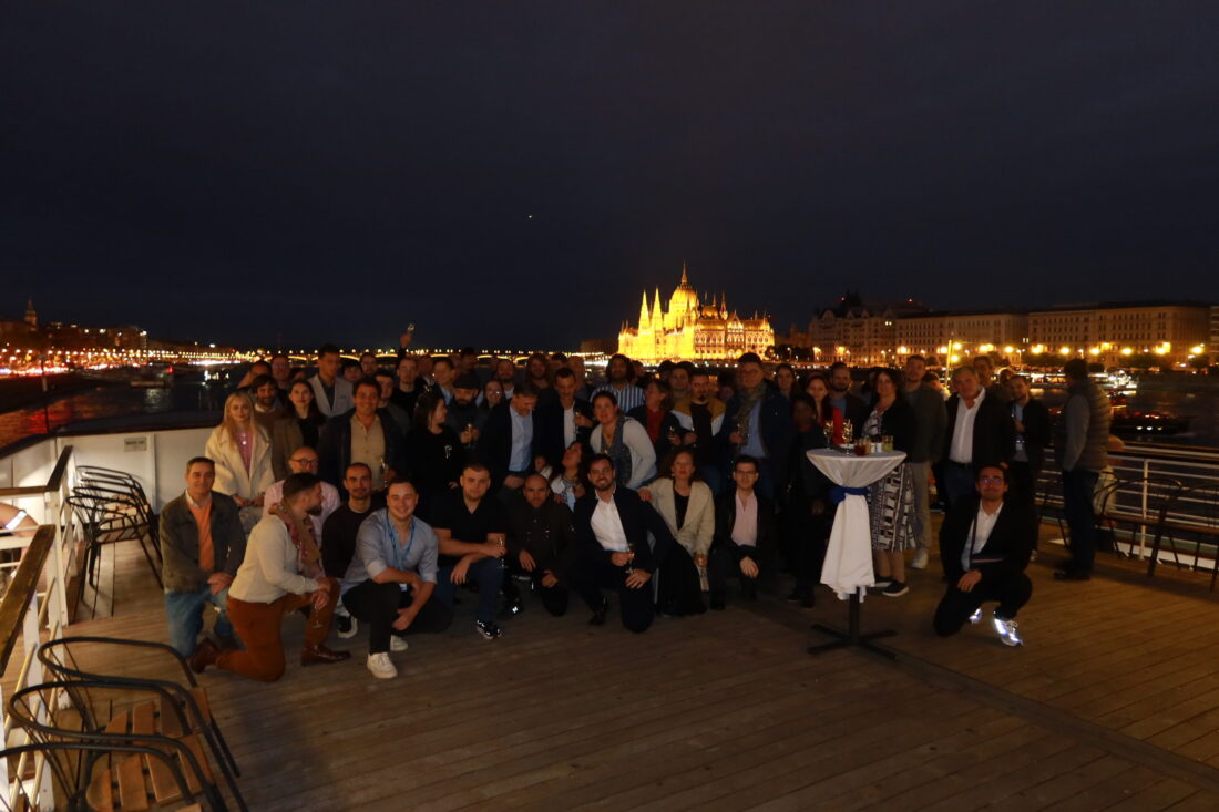 Sightseeing cruise boat sailing along the Danube River with the Budapest skyline in the background