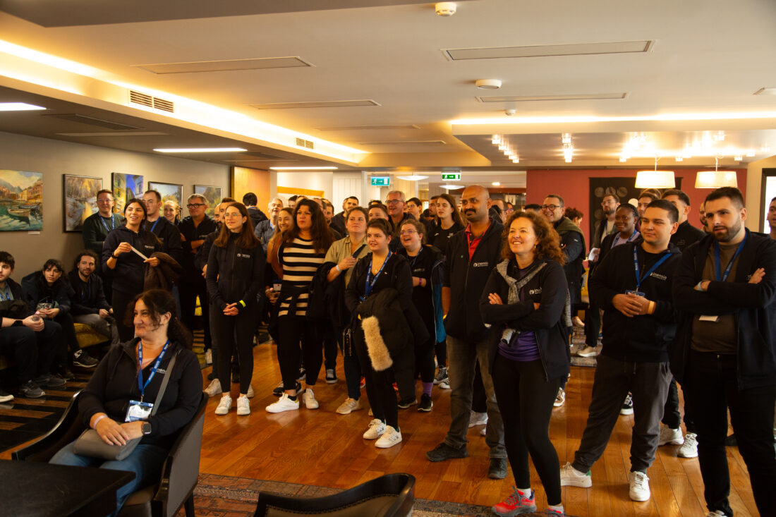 Inensia's team gathered to hear a message filmed from a teammate