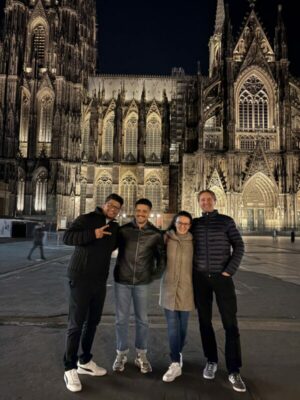 The team gathered together in from of the Cathedral